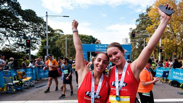 Sydney Half content post race finishers female arms up right2